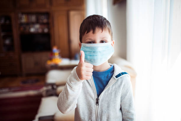istock Cute little boy wearing surgical mask 1220404871