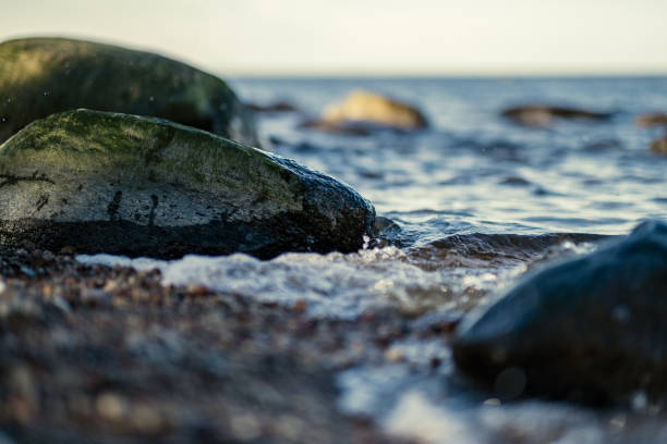 istock waves crushing on the rocks on beach 1220407004