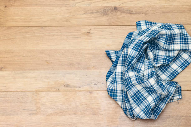 istock napkin tablecloth above wooden background 1220408242