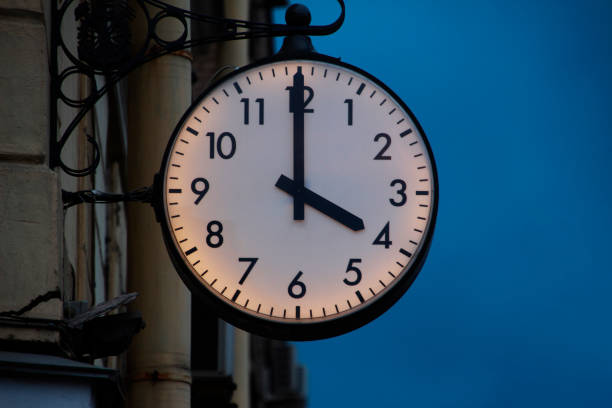 Street clock showing four hours stock photo
