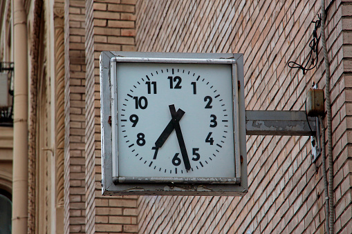 Clock and leaded window in the São Bento railway station in Porto.