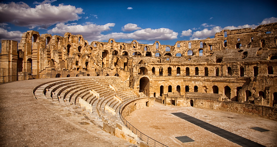 The impressive ruins of the largest colosseum in North Africa, a huge Roman amphitheater in the small village of El Jem, Tunisia. UNESCO World Heritage Site