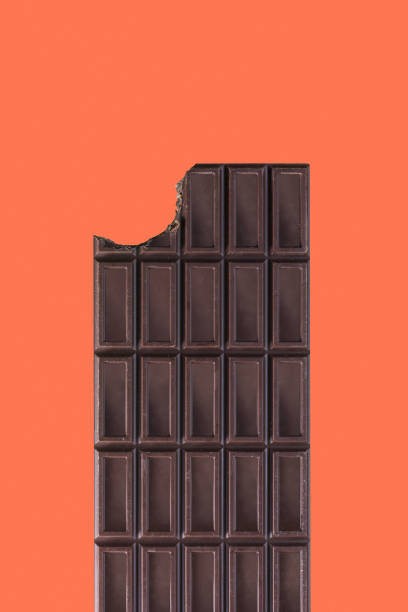 istock isolated chocolate bar on a orange background 1220411596
