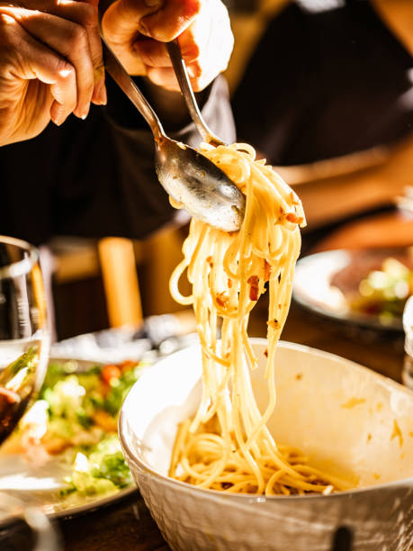 istock Eating Carbonara Italian style lunch 1220411832