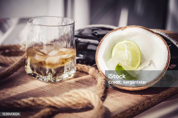 Bottle Of Old Rum Nintendo Rum With Ice Stock Photo - Download Image Now - Alcohol - Drink, Bottle, Brandy