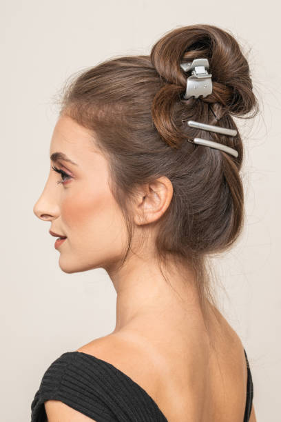 istock Woman With Hair Clips 1220413530