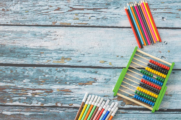 istock Wooden abacus, felt tip pens and colored pencils 1220413900