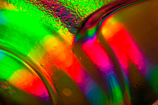 Image of a colored tablecloth through a crystal glass