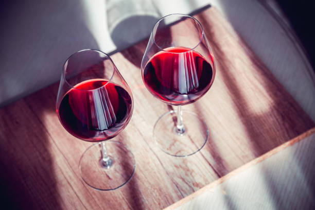 istock Glasses of red wine, on a kouon table, red wine 1220415615