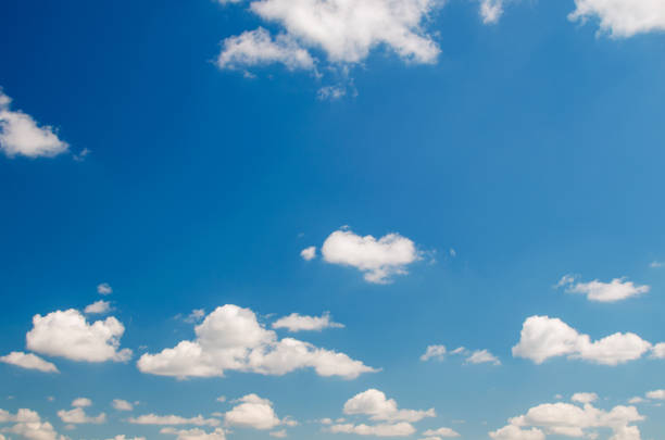 istock Beautiful fluffy clouds against the blue sky 1220418357
