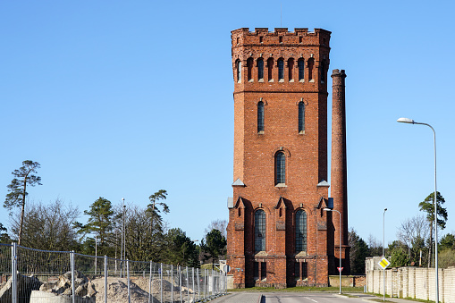 This appears to be a very well-built and sturdy water tower located in a small southern USA town.