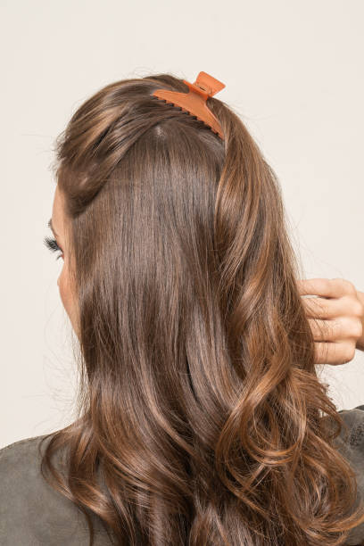 istock Woman With Hair Clips 1220419565
