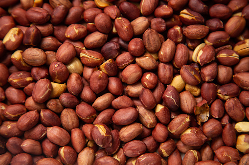 Shelled hazelnuts photographed from above. The image can be used as a background or to add text.