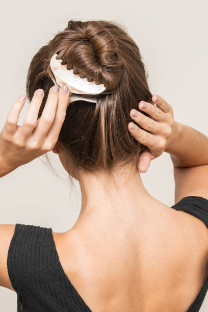 istock Woman With Hair Clips 1220420374