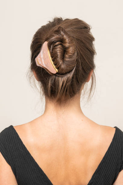 istock Woman With Hair Clips 1220420376
