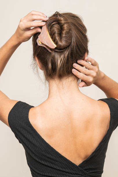 istock Woman With Hair Clips 1220420378