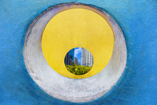 abstract circular frame at the cityscape background with trees