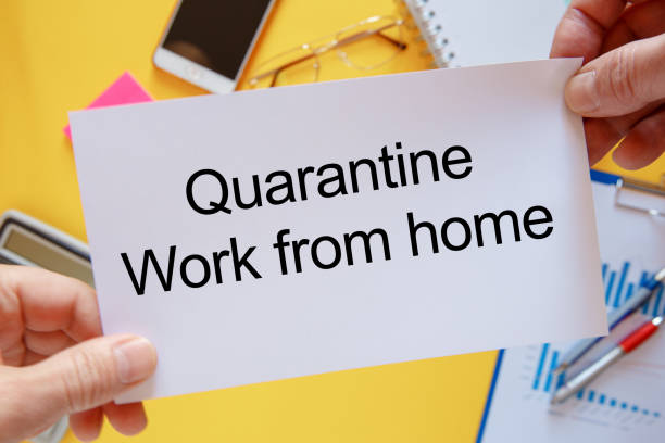 istock Photo on top of workspace card with text - Quarantine Work from home 1220421172