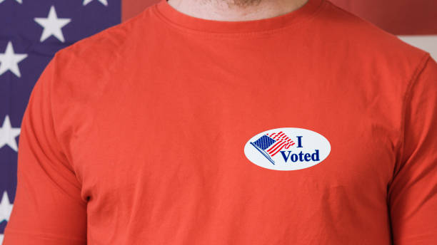 istock Presidential election button on a man 1220421435
