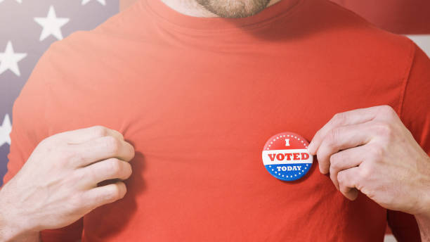 istock Presidential election button on a man 1220421440