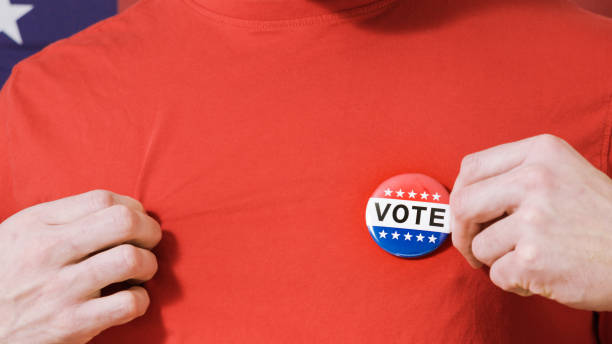 istock Presidential election button on a man 1220421451