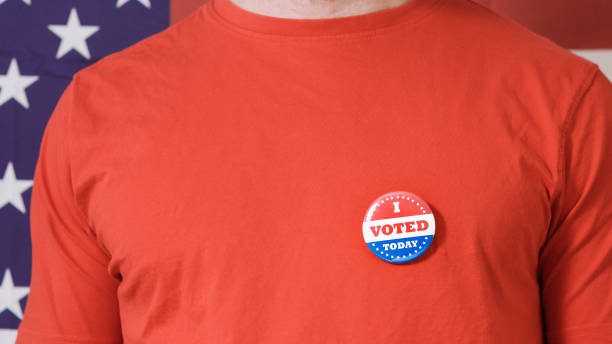 istock Presidential election button on a man 1220421460