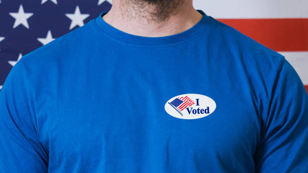 istock Presidential election button on a man 1220421498