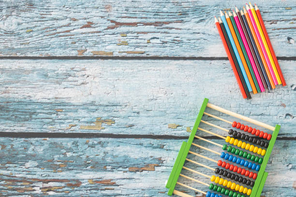 istock Wooden abacus and colored pencils 1220422803