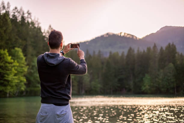 istock Man Taking Photos With Phone 1220423173