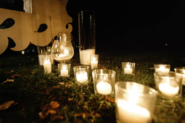 istock romantic candle light in glass lanterns at luxury wedding ceremony in evening, decor and arrangements 1220423840