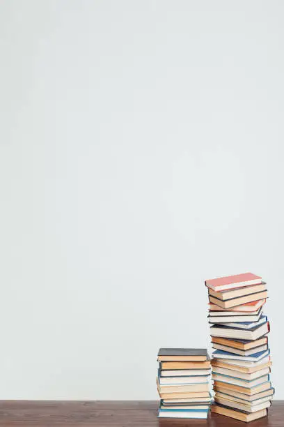 Photo of a lot of stacks of educational books in the library on a white background