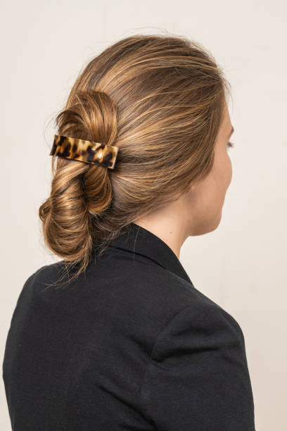istock Woman With Hair Clips 1220424842