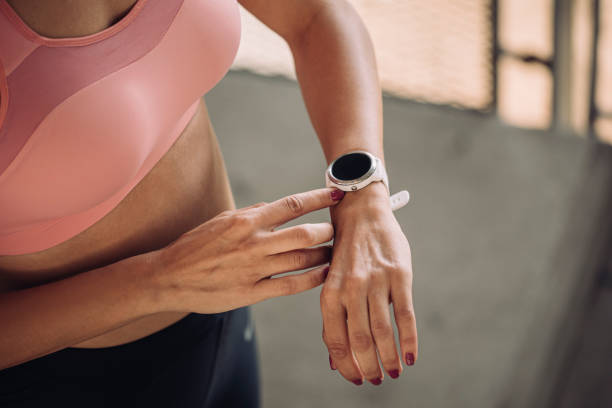 istock Unrecognizable Woman Runner Taking Pulse on a Smartwatch, a Close Up 1220425076
