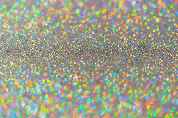 istock Abstract shiny colored sparkles background with blur bokeh. 1220425147