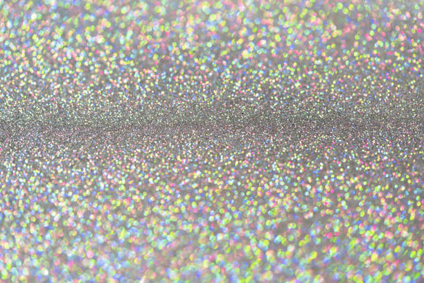 istock Abstract shiny colored sparkles background with blur bokeh. 1220425154
