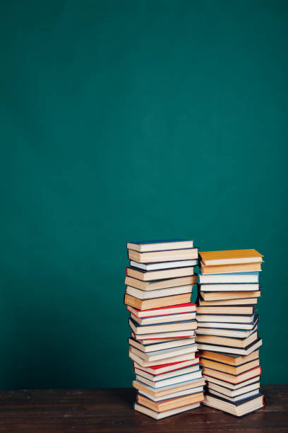 istock many stacks of educational books in the university library on a green background 1220425436