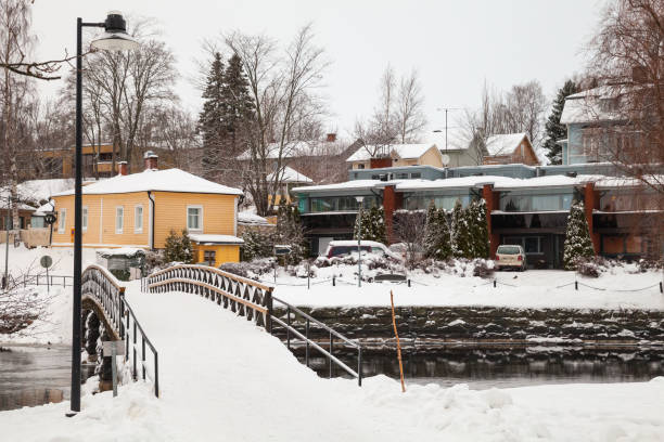 Savonlinna winter landscape. Small walking bridge Savonlinna winter landscape. Small walking bridge over a snowy river etela savo finland stock pictures, royalty-free photos & images