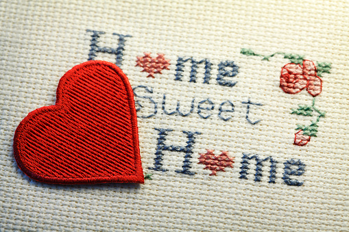 Pillow with heart and floral pattern on the sofa