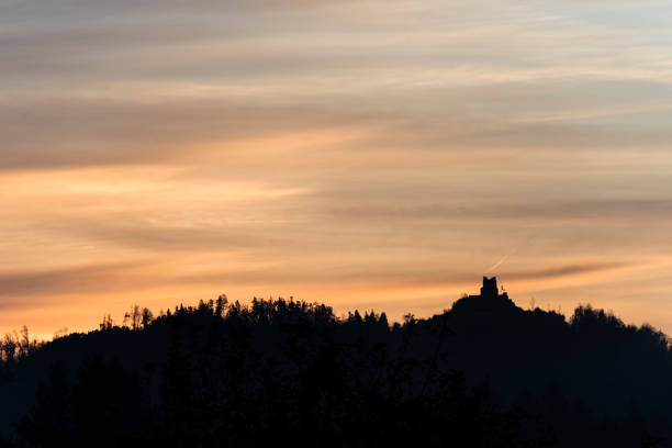 istock Old building on a forested mountain silhouetted 1220426796