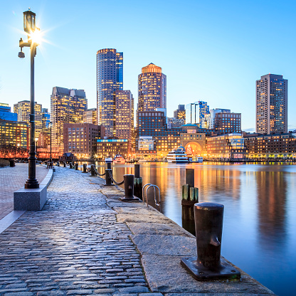 The historic architecture of the Boston Harbor and Financial District at night.