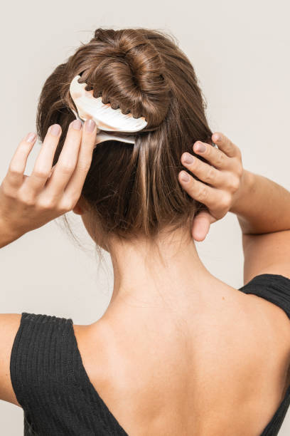 istock Woman With Hair Clips 1220427778