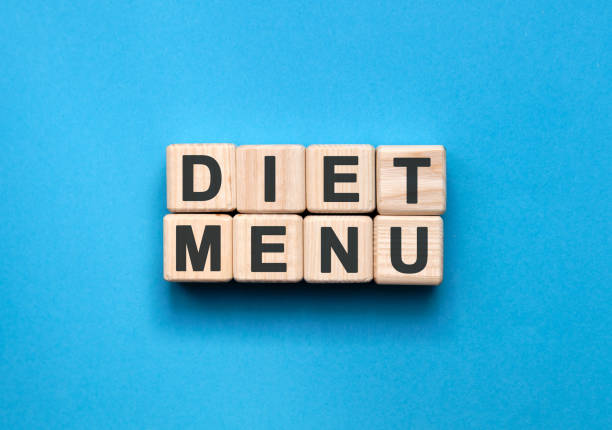 istock DIET MENU - text on wooden cubes on a blue background 1220427943