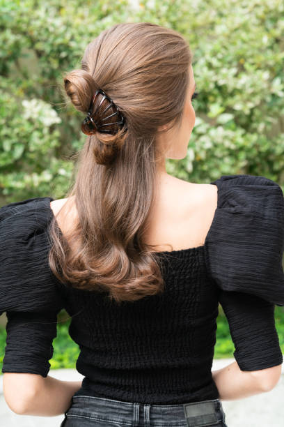 istock Woman With Hair Clips 1220428409