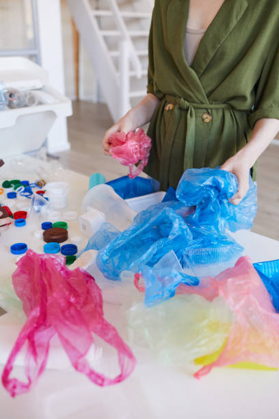 istock Woman Sorting Waste for Recycling 1220429865