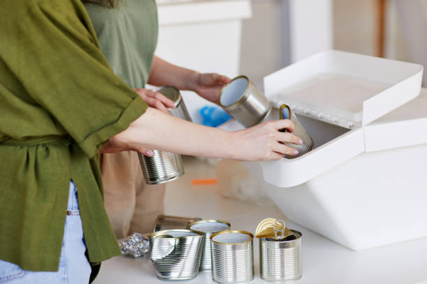 istock Unrecognizabe Woman Sorting Waste at Home 1220429946