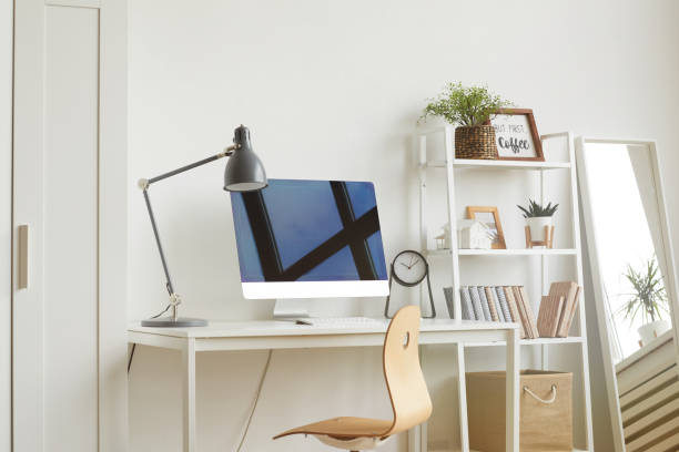 Minimal Design Ideas for Home Office White Background image of empty home office workplace with wooden chair and modern computer on white desk, copy space college dorm photos stock pictures, royalty-free photos & images