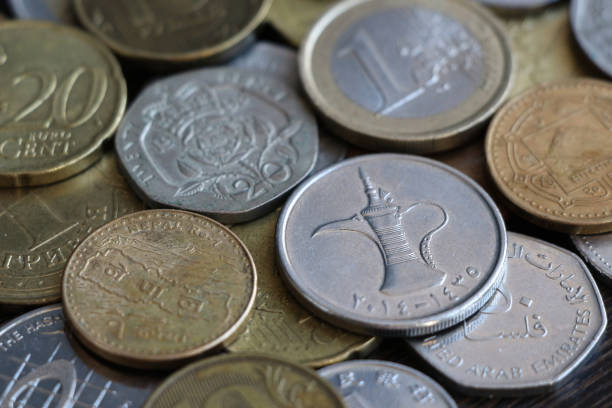 istock One dirham coin lies on coins of other countries 1220431097