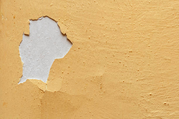 istock Old yellow paint is peeling off the wall 1220433185