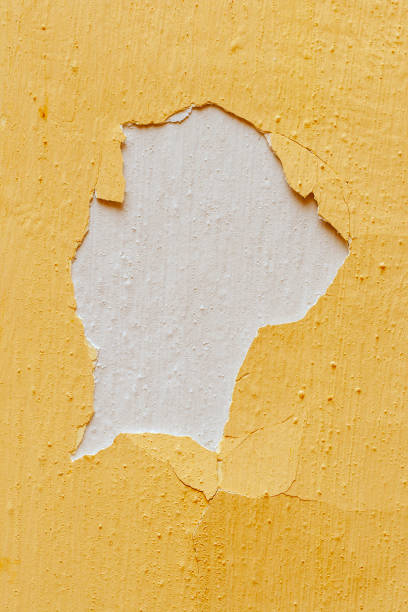 istock Old yellow paint is peeling off the wall 1220433800