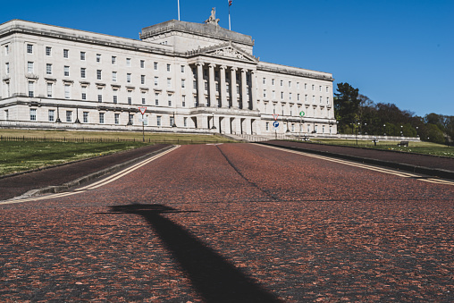 Belfast, Northern Ireland, United Kingdom - April 21, 2020:  The front facade of the Stormont Parliamentary Building, which houses the Northern Ireland Assembly.  It was completed in 1932 to the designs of Sir Arnold Thornely.